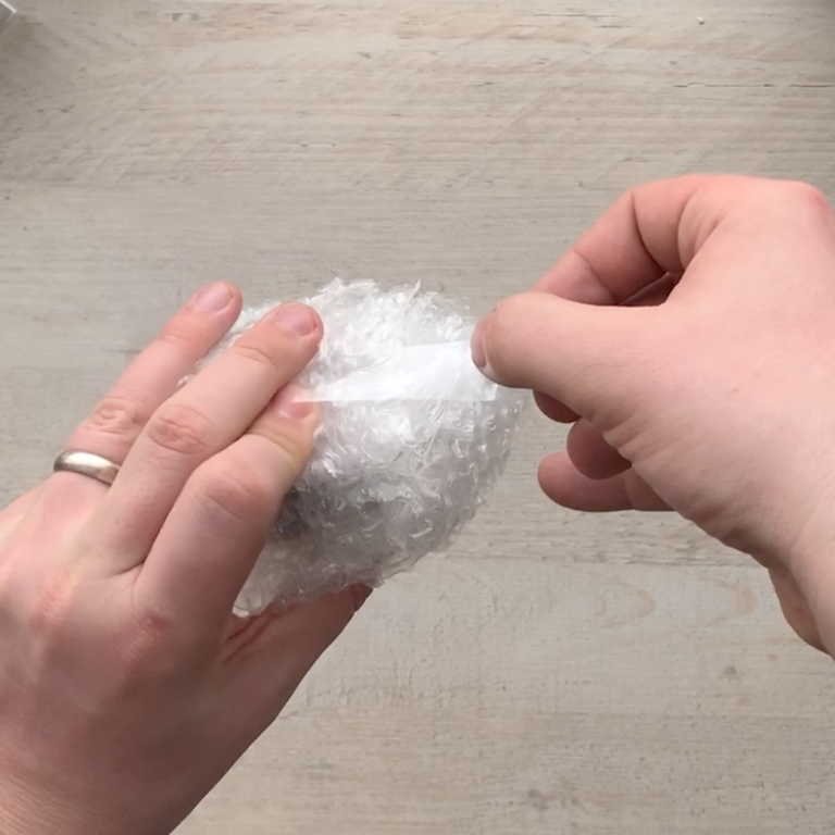 Securing the bubble wrap with adhesive tape