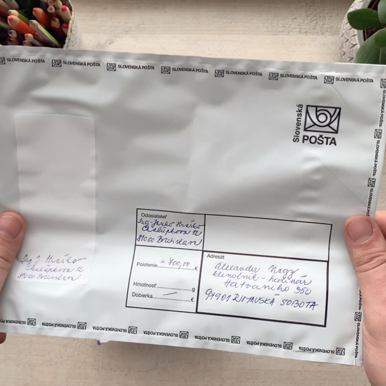 Filling in the insured envelope for the watch parcel