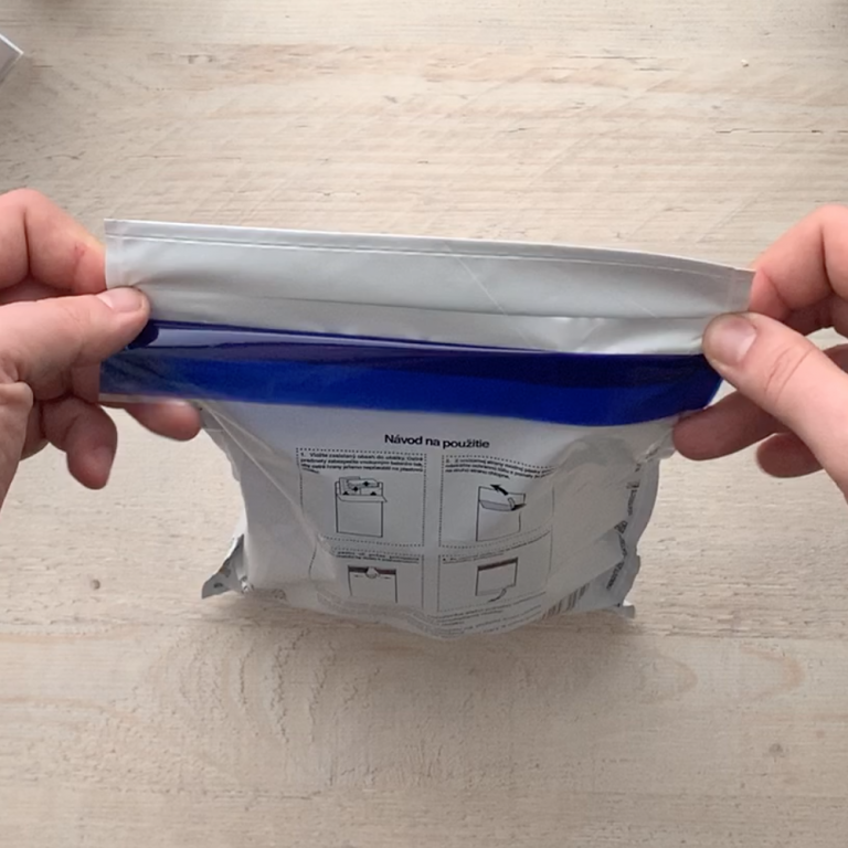 Placing the watch and cover letter into the envelope